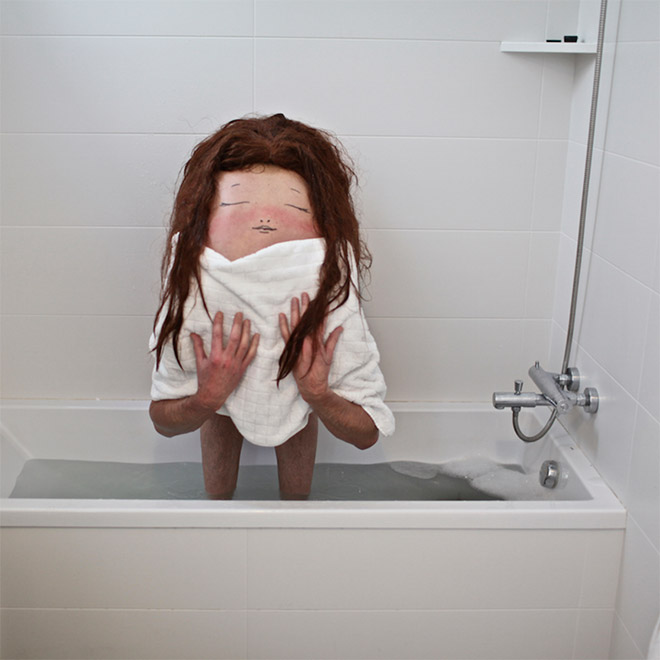 Creepy creature standing in a bath.