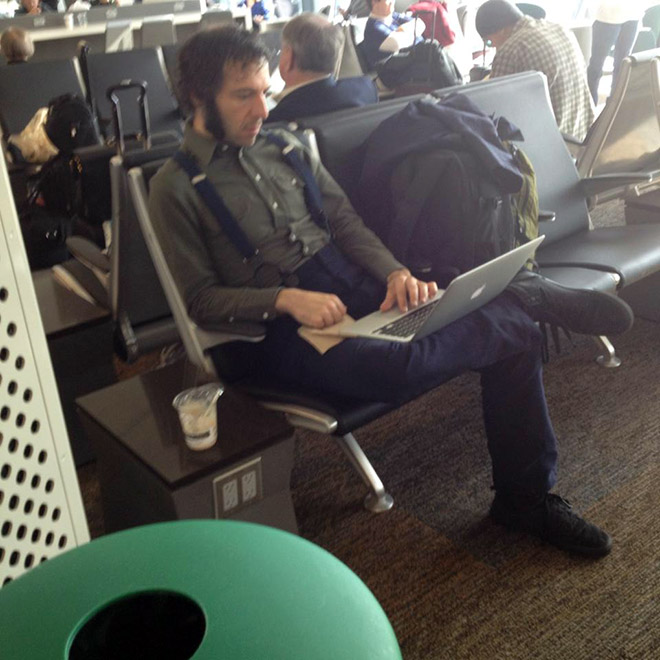 Hipster writing his blog.