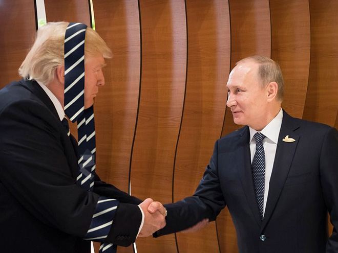 Trump greeting Putin while wearing his favorite tie.