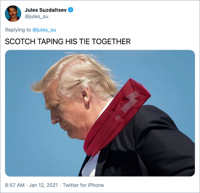SCOTCH TAPING HIS TIE TOGETHER