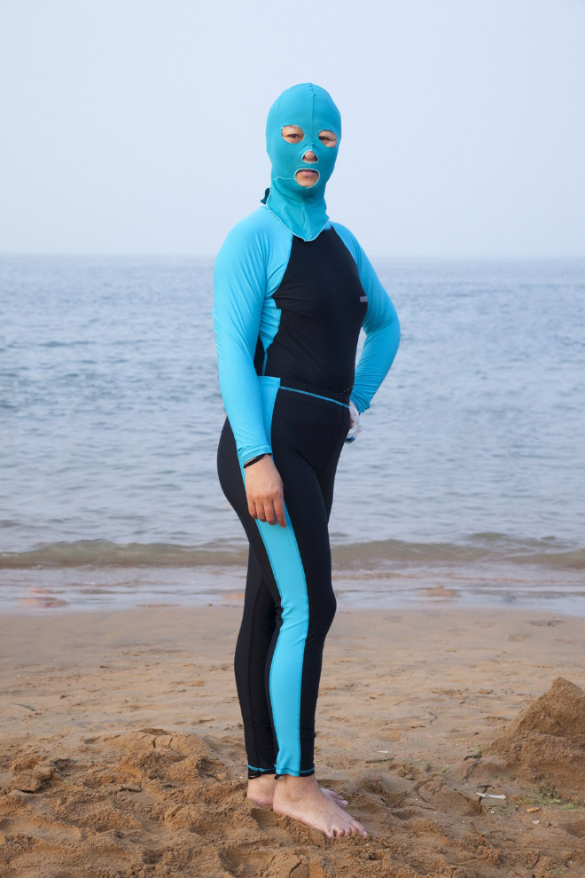 Facekini swimsuits is a weird trend in China.