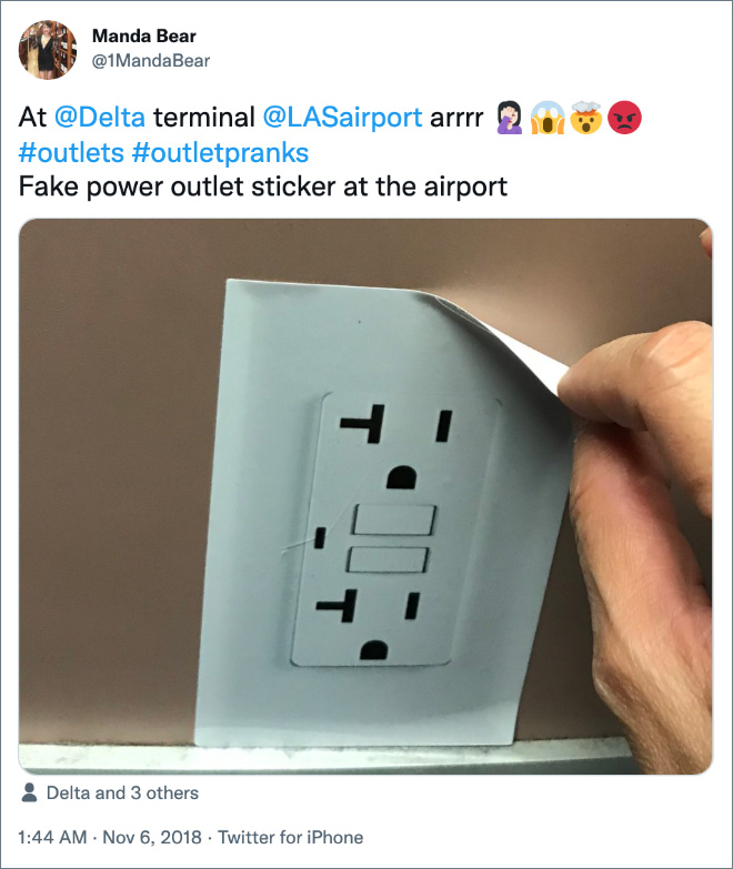Fake power outlet sticker at the airport