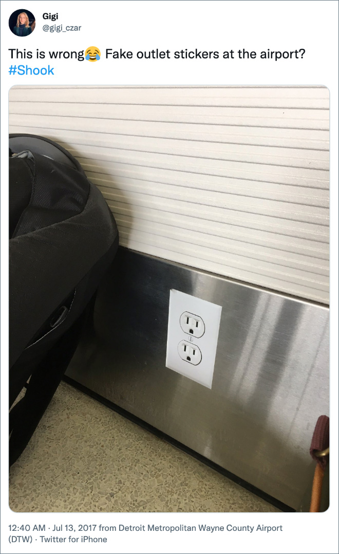 Fake outlet stickers at the airport?