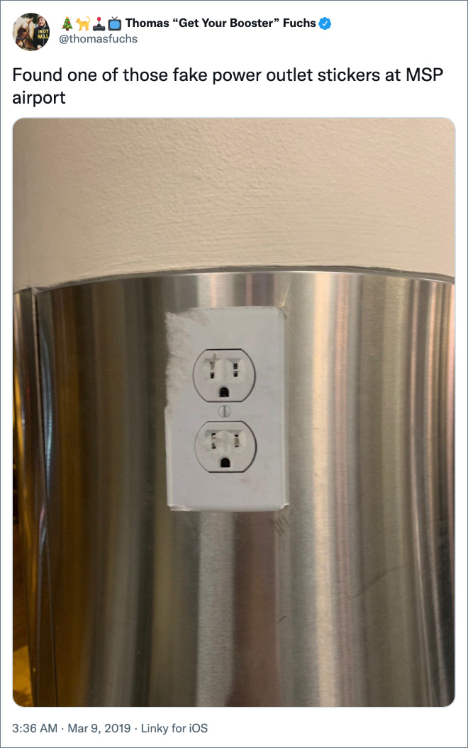 Found one of those fake power outlet stickers at MSP airport