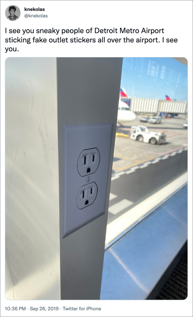 I see you sneaky people of Detroit Metro Airport sticking fake outlet stickers all over the airport. I see you.